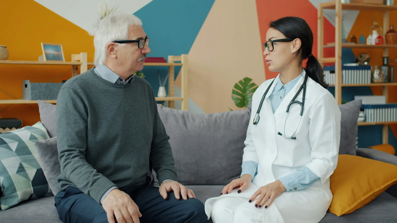 Older adult discussing health results with a doctor