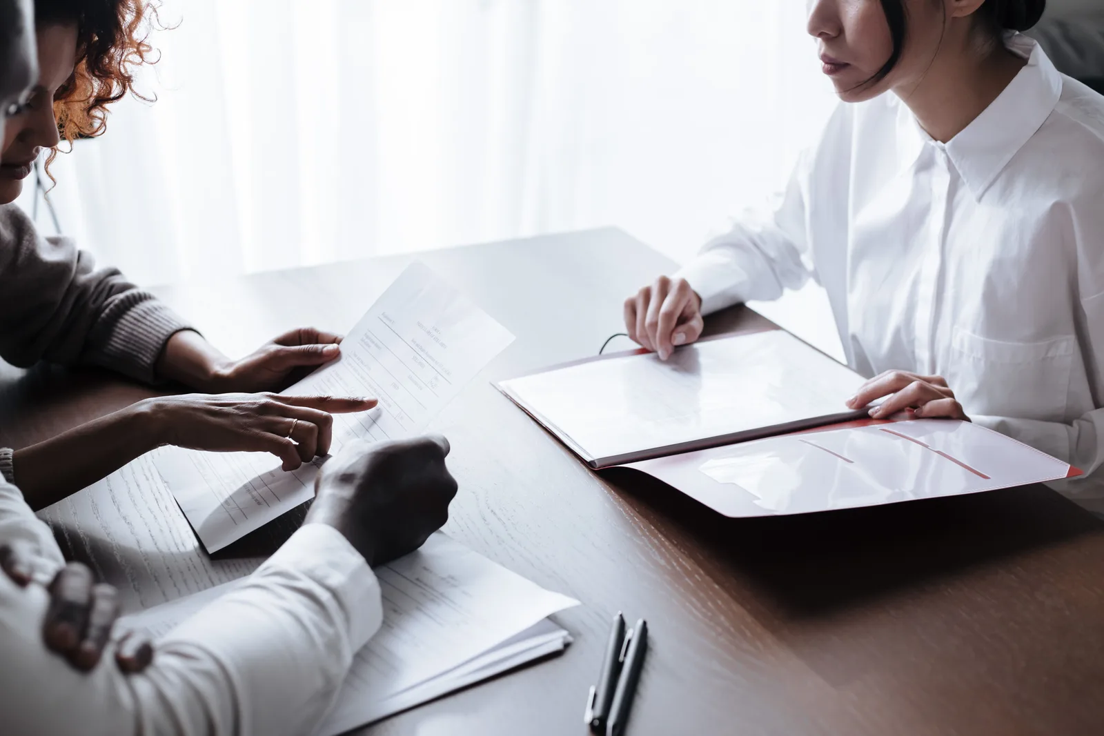 Couple reviewing paperwork together at a table